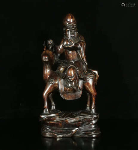 A CHENXIANG WOOD CARVED FIGURE SHAPED PENDANT