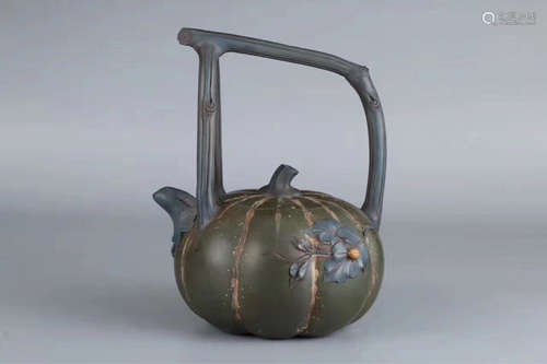 A PUMPKIN DESIGN PURPLE CLAY TEAPOT