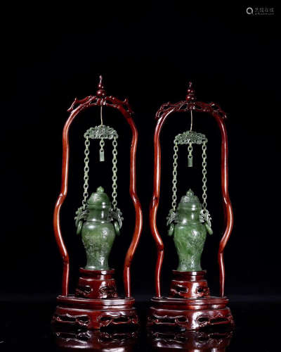 18-19TH CENTURY, A PAIR OF HETIAN GREEN JADE BOTTLE DESIGN ORNAMENTS, LATE QING DYNASTY