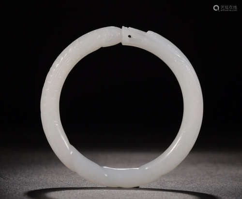 A HETIAN JADE CARVED BANGLE