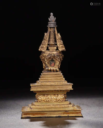 A GILT COPPER BUDDHIST TOWER