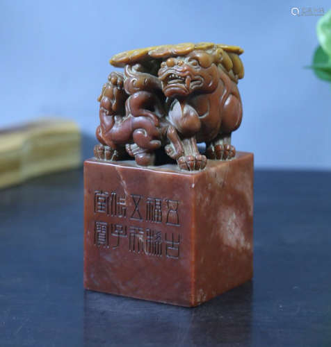 A SOAPSTONE CARVED BEAST SHAPED SEAL