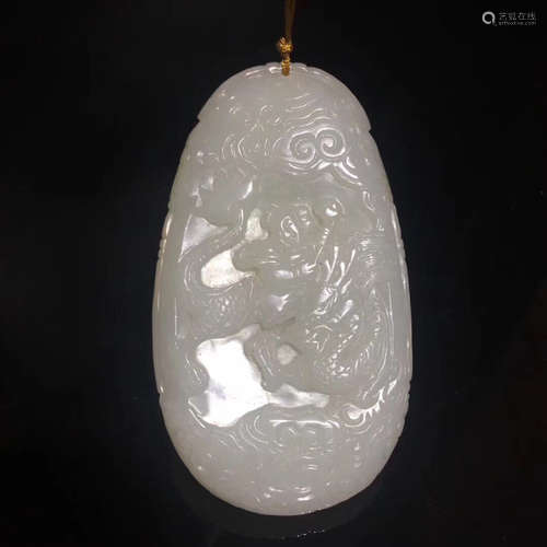 A WHITE JADE CARVED PENDANT