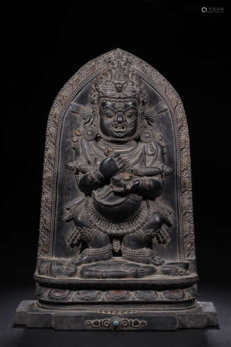 A BLACK STONE CARVED DAHEITIAN BUDDHA FIGURE