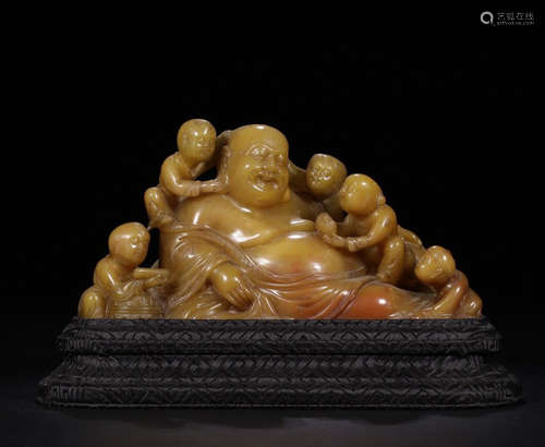 A SOAPSTONE CARVED LAUGHING BUDDHA