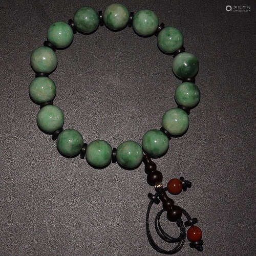 AN OLD TIBETAN JADEITE BRACELET