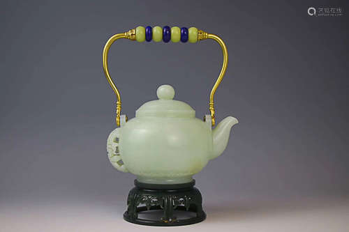 AN OLD TIBETAN HETIAN JADE LIFTING-HANDLE TEAPOT