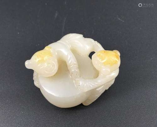 A white jade carved boy figures