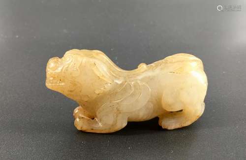 A white jade carved Pi Xiou figure