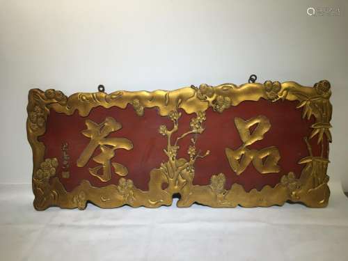 An old gilt wooden plaque