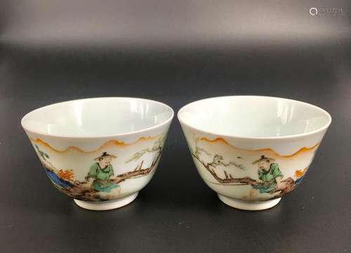 A pair of superbly painted famille rose cups