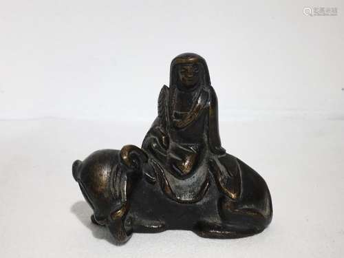 A solid bronze carved paperweight