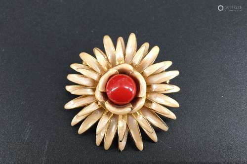 A gilt/enamelled coral brooch