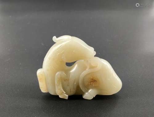 A celadon jade carved ram figure