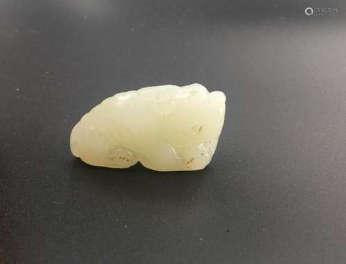 A white jade carved pendant, beast