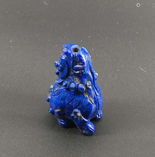 A lapis lazuli carved QiLing figure snuff bottle