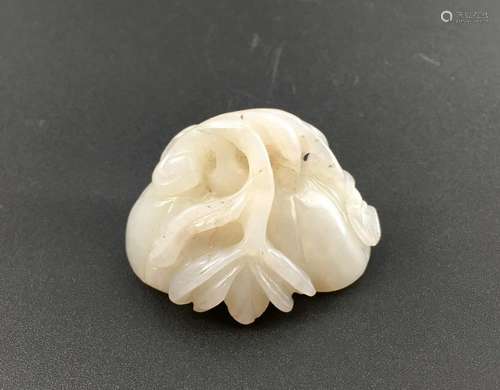 A white jade carved lotus root form ornament