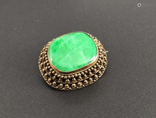 A gilt silver jadeite brooch, marked