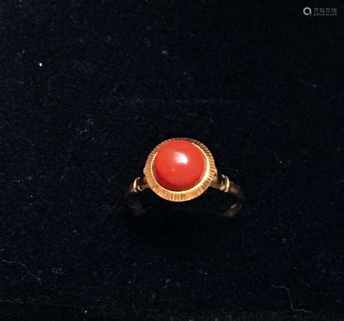 A gilt red coral ring