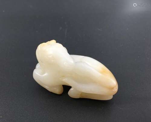 A white jade carved horse figure