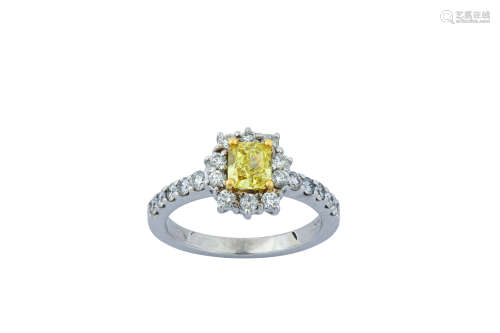 A fancy coloured diamond and diamond cluster ring