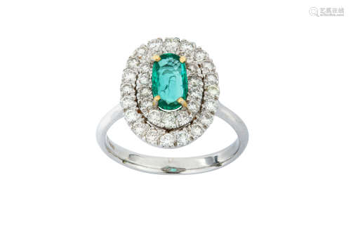 An emerald and diamond ring