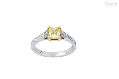 A fancy-coloured diamond and diamond ring