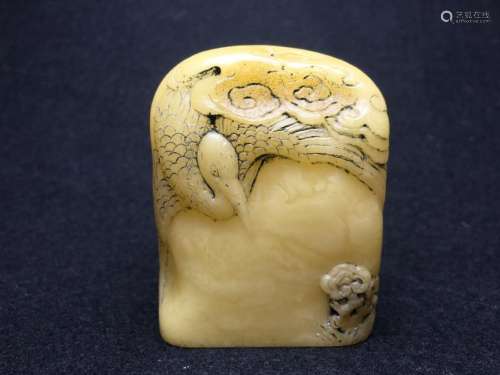 A Carved 20th Century Amber Crane Pine Seal