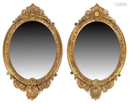 Property of a lady - a pair of Victorian gilt composition oval framed wall mirrors, each 29.