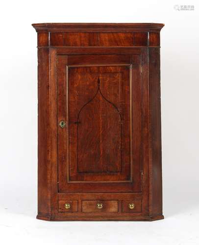 Property of a deceased estate - a George III oak & mahogany single door corner wall cabinet,