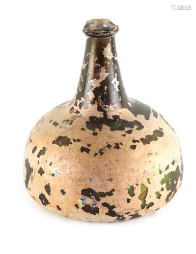 Property of a lady - a late 17th / early 18th century onion shaped wine bottle, with iridescence,