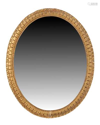 Property of a gentleman - an early 20th century gilt oval framed wall mirror, 29.35ins. (74.5cms.)