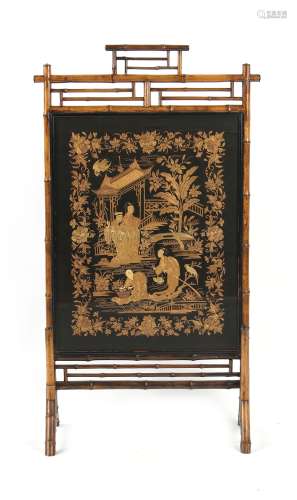 A late 19th / early 20th century bamboo screen, the Chinese silk panel worked in couched gold