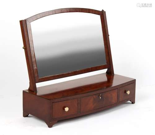 Property of a gentleman - a George III mahogany rectangular swing-frame toilet mirror, with bow-