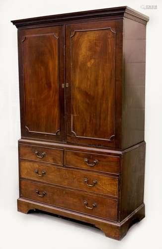 Property of a lady - a George III mahogany two-part linen press, the base with original gilt brass