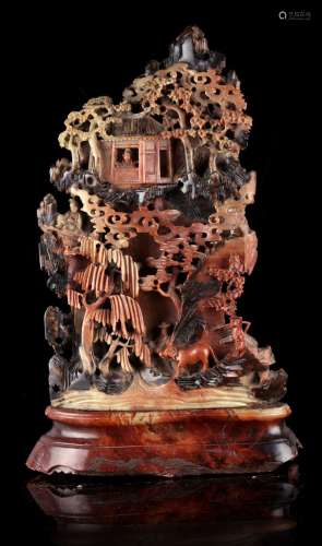 A large early 20th century Chinese carved soapstone mountain, with figures & buffalo on terraces &
