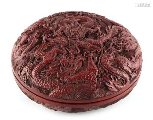 A Chinese carved cinnabar lacquer circular box & cover, decorated with five dragons chasing