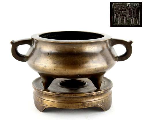 A Chinese bronze tripod two-handled censer on stand, probably late 19th century, with apocryphal