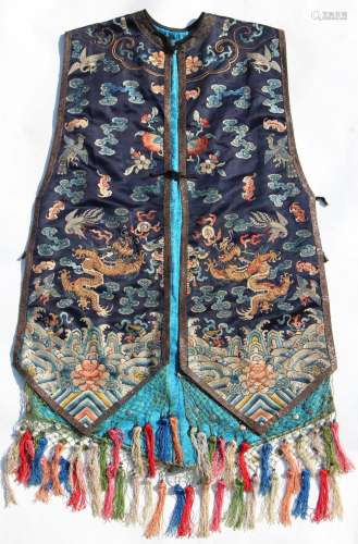 A good Chinese navy blue silk sleeveless jacket, late 19th / early 20th century, decorated in gilt