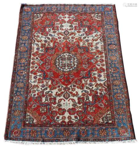 Property of a deceased estate - a Turkish hand knotted wool rug, with ivory field, 72 by 53ins. (183