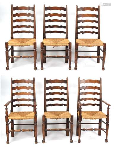 Property of a gentleman - a set of six oak & rush seated ladder-back dining chairs including two