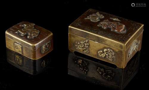 Two small Japanese mixed metal boxes, the larger 2.3ins. (5.8cms.) wide (2) (see illustration).