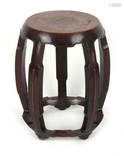 A late 19th / early 20th century Chinese carved hongmu drum stool, with burr wood circular panel
