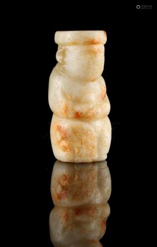 A Chinese carved greyish white & russet jade toggle modelled as a seated man, probably Ming