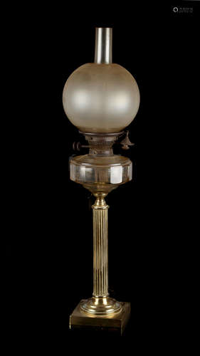 Property of a deceased estate - a brass paraffin oil lamp, with faceted clear glass reservoir,