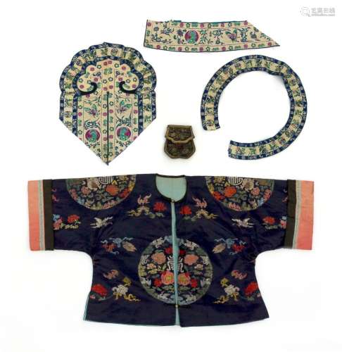 An early 20th century Chinese navy blue silk jacket, decorated with bats, butterflies,