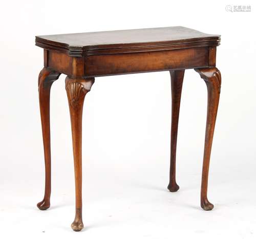 Property of a gentleman - a reproduction swivel-top foldover card table with shell carved cabriole