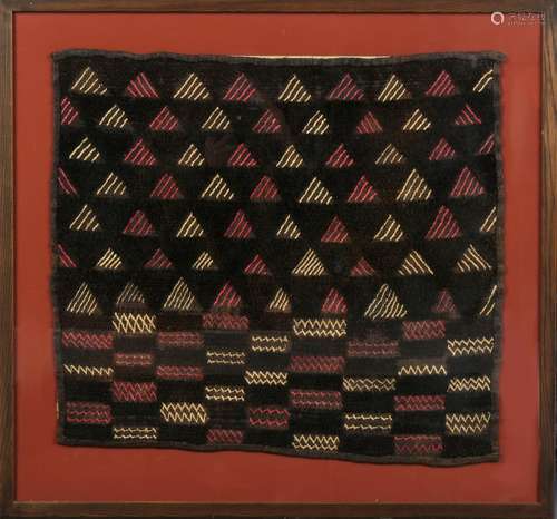 Property of a deceased estate - a Baluchi weaving, in glazed frame, 29 by 31ins. (74 by 79cms.) (