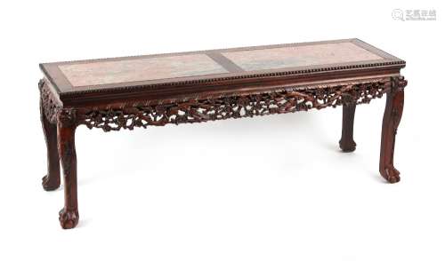 A Chinese carved hongmu rectangular topped table, circa 1900, the top inset with twin mottled pink