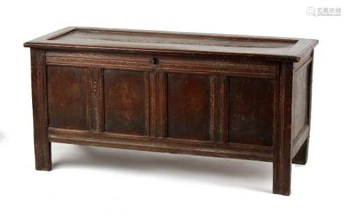 Property of a lady - an early 18th century oak coffer with four panel front, 54.5ins. (138.5cms.)